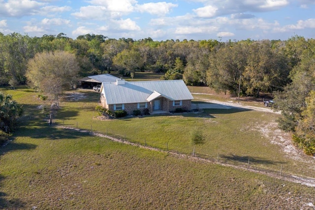 drone / aerial view with a rural view and a wooded view