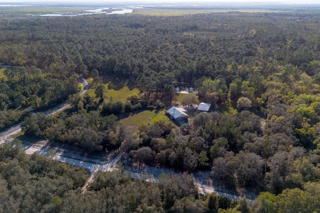 bird's eye view featuring a wooded view