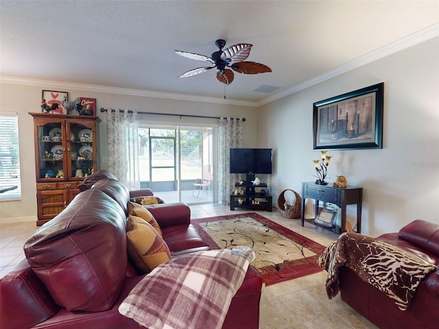 living area with light tile patterned flooring, visible vents, crown molding, and a ceiling fan