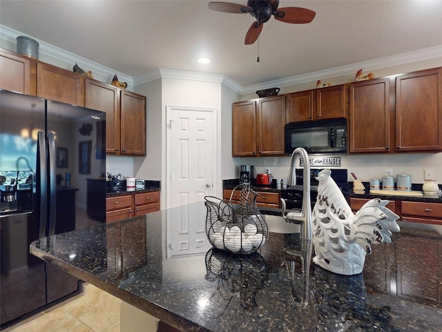 kitchen with light tile patterned floors, dark stone counters, ceiling fan, black appliances, and crown molding