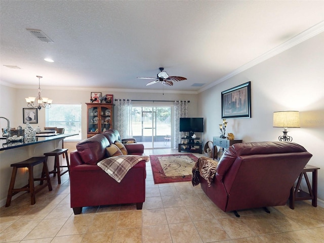 living area with light tile patterned floors, visible vents, and ornamental molding