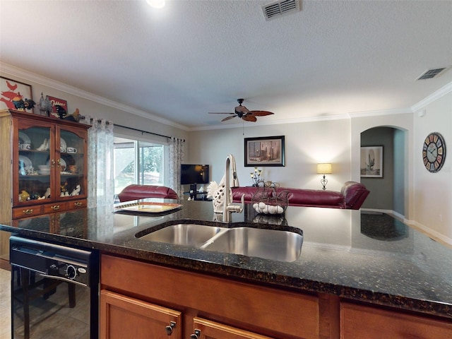 kitchen featuring open floor plan, visible vents, black dishwasher, and a sink