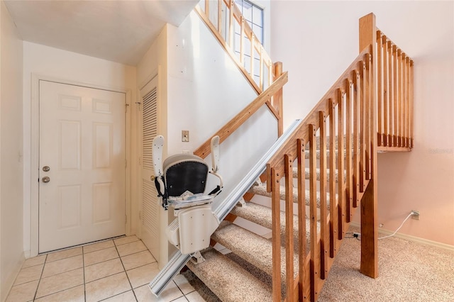 stairs featuring tile patterned floors