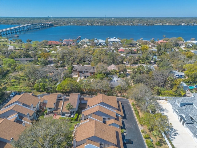 drone / aerial view with a residential view and a water view