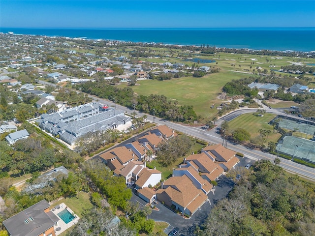 drone / aerial view featuring a residential view and a water view