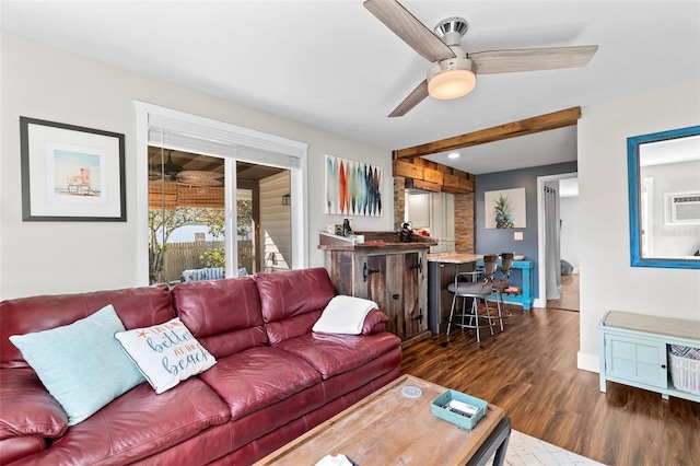 living room featuring a wall mounted AC, a ceiling fan, and wood finished floors