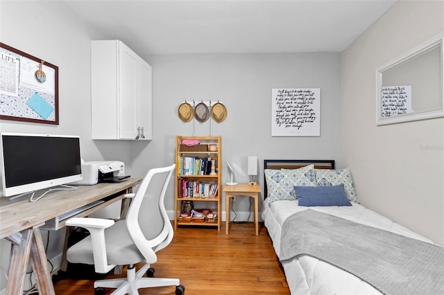 bedroom with light wood-type flooring