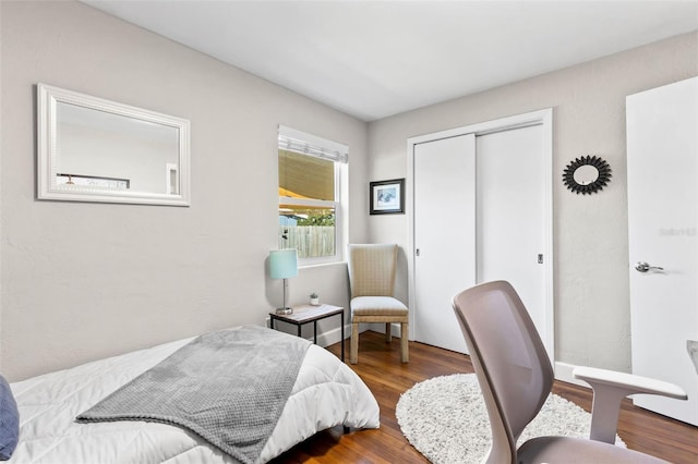 bedroom with a closet and wood finished floors