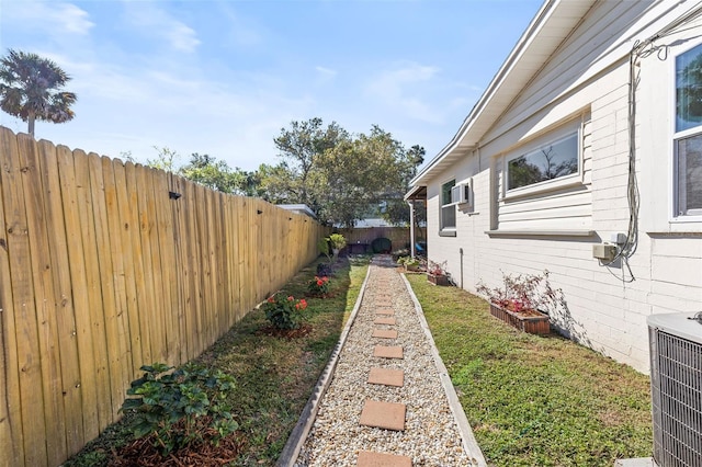 view of yard featuring cooling unit and a fenced backyard