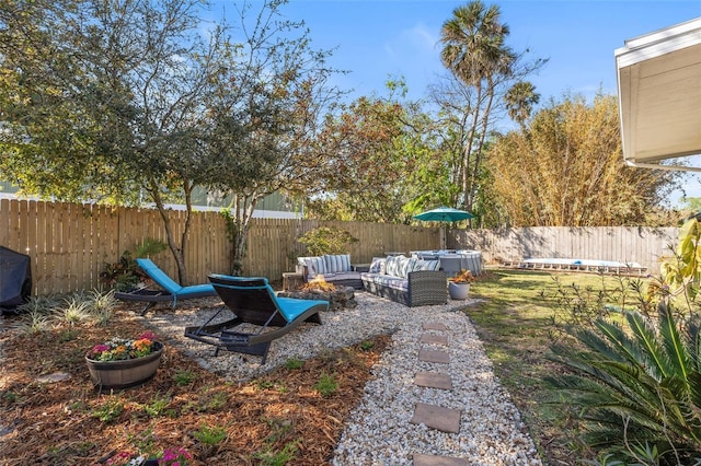 view of yard featuring an outdoor living space and a fenced backyard