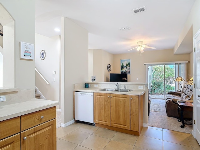 kitchen with visible vents, a ceiling fan, a sink, light tile patterned floors, and dishwasher