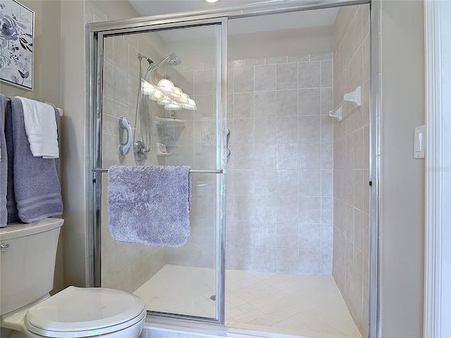 full bathroom with toilet and a stall shower