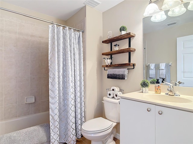 bathroom with visible vents, toilet, and vanity