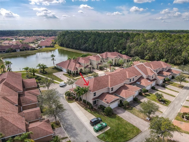 bird's eye view featuring a residential view and a water view
