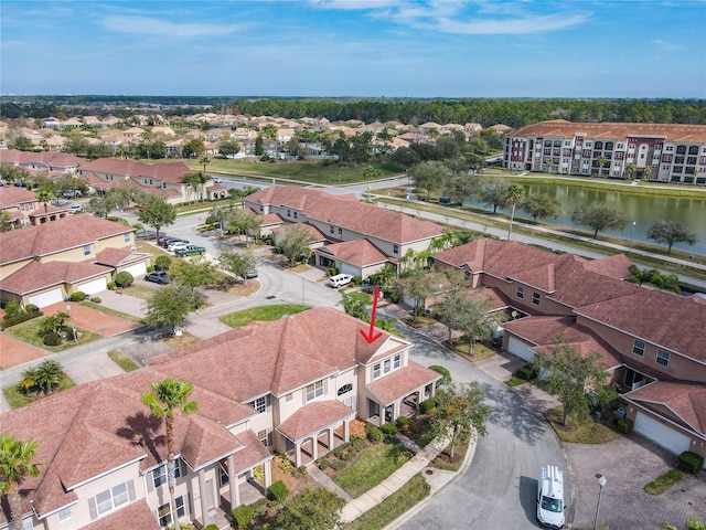 bird's eye view with a residential view and a water view