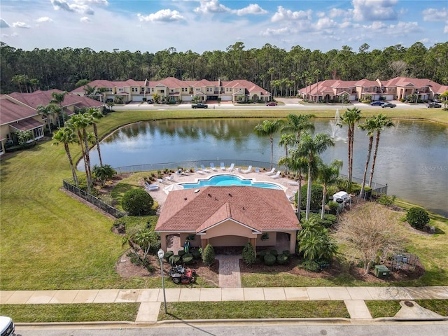 drone / aerial view featuring a residential view and a water view