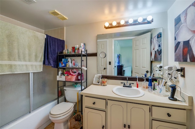 full bath featuring shower / bath combination with glass door, visible vents, toilet, and vanity