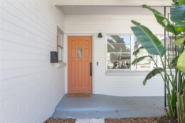 property entrance with concrete block siding