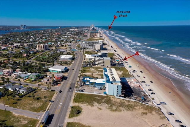 aerial view with a water view, a city view, and a beach view