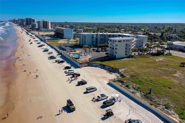 aerial view featuring a view of city, a view of the beach, and a water view