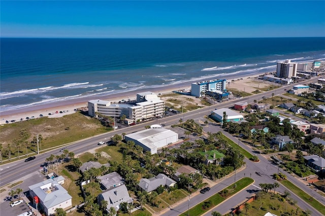 bird's eye view featuring a beach view and a water view