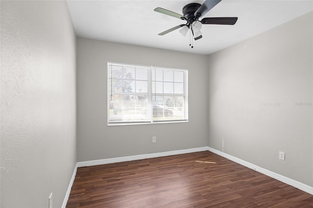 unfurnished room with ceiling fan, baseboards, and wood finished floors