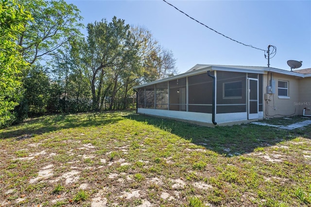 view of yard with a sunroom