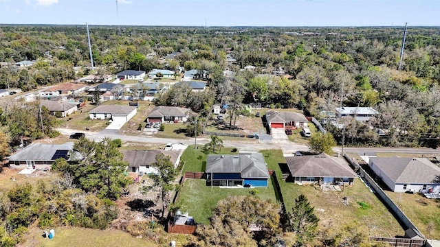 bird's eye view featuring a residential view and a view of trees