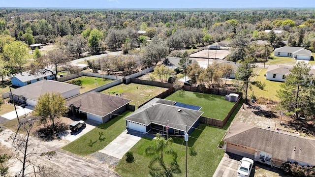 drone / aerial view featuring a view of trees