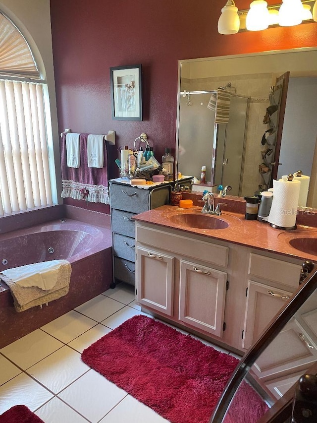 full bath with a whirlpool tub, a stall shower, vanity, and tile patterned flooring