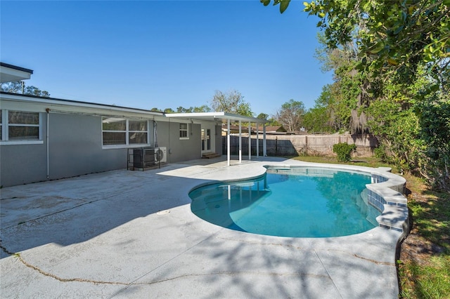 view of pool with a fenced in pool, a patio area, and fence