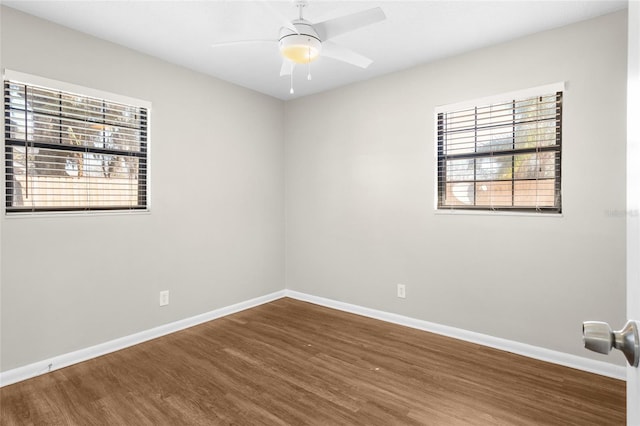 unfurnished room featuring ceiling fan, baseboards, and wood finished floors