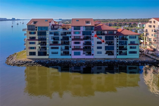 view of building exterior with a water view