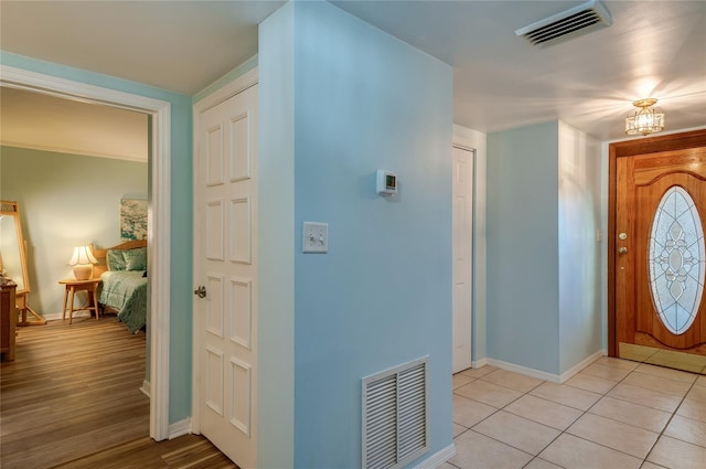 732 Marina Point Dr Unit 7320, Daytona Beach, FL 32114 - entryway featuring light tile patterned flooring, visible vents, an inviting chandelier, and baseboards