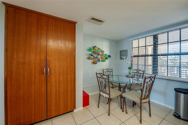 732 Marina Point Dr Unit 7320, Daytona Beach, FL 32114 - dining room with light tile patterned flooring, visible vents, and baseboards