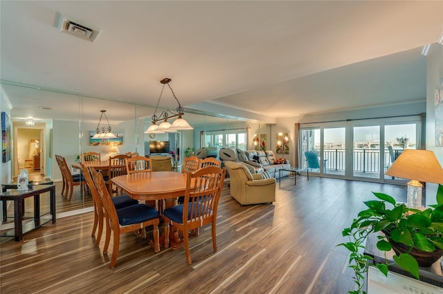 732 Marina Point Dr Unit 7320, Daytona Beach, FL 32114 - dining room featuring visible vents and dark wood-type flooring