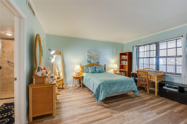 732 Marina Point Dr Unit 7320, Daytona Beach, FL 32114 - bedroom featuring crown molding, light wood-style floors, visible vents, and baseboards