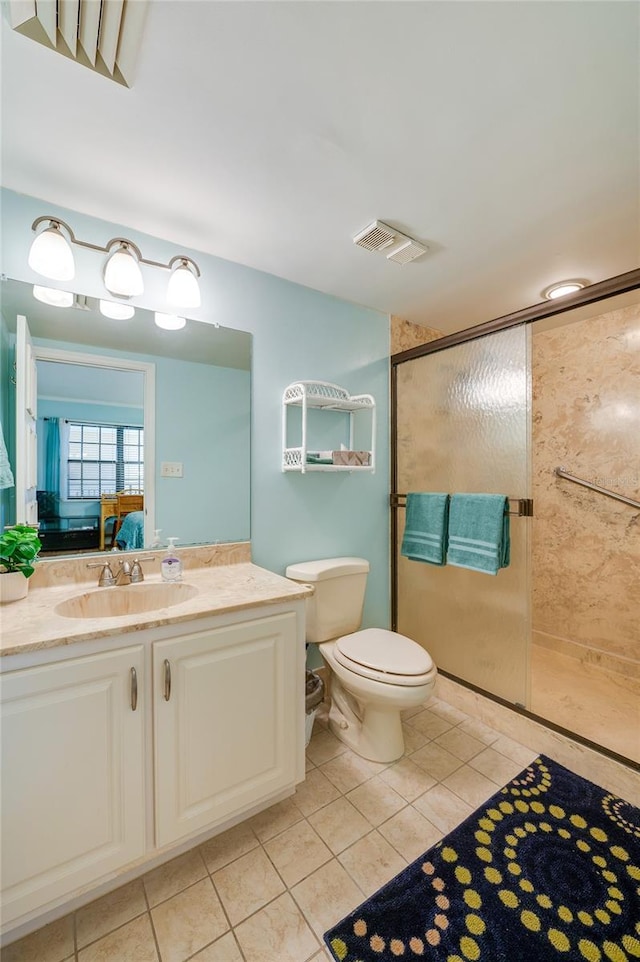 732 Marina Point Dr Unit 7320, Daytona Beach, FL 32114 - bathroom featuring vanity, visible vents, a stall shower, tile patterned floors, and toilet