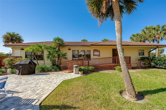 732 Marina Point Dr Unit 7320, Daytona Beach, FL 32114 - rear view of house featuring a lawn and a tile roof