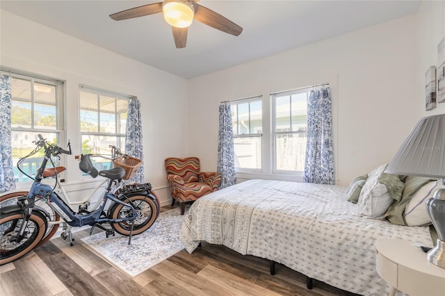 bedroom with wood finished floors and ceiling fan