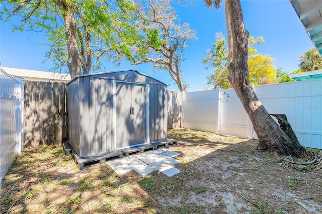 view of shed with a fenced backyard