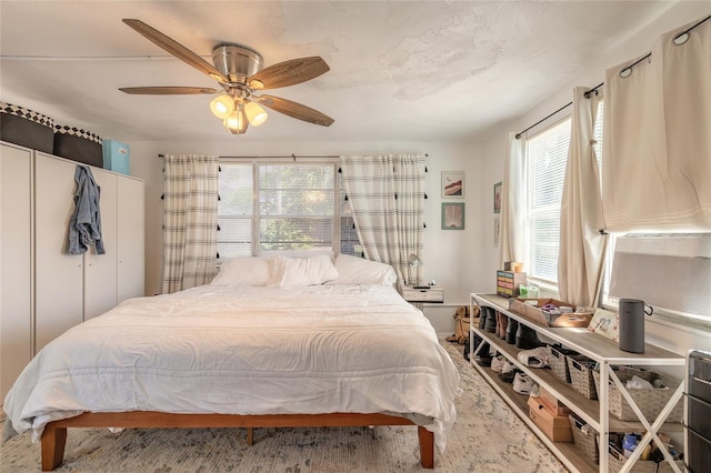bedroom featuring ceiling fan