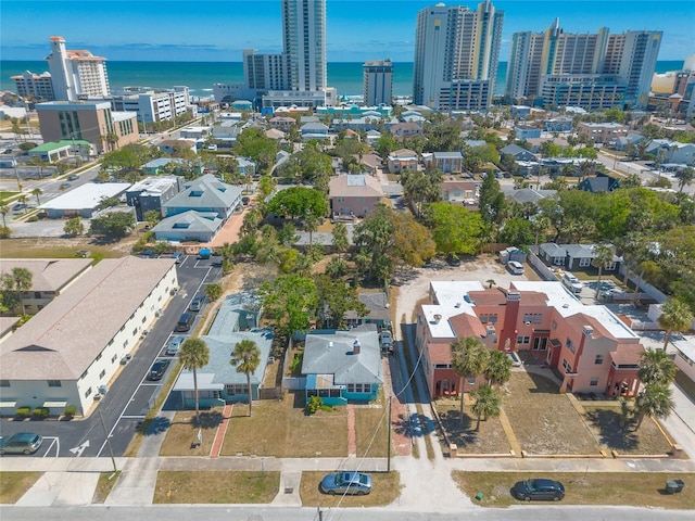 aerial view featuring a city view and a water view