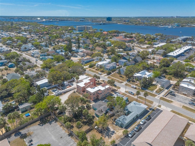 drone / aerial view with a residential view and a water view