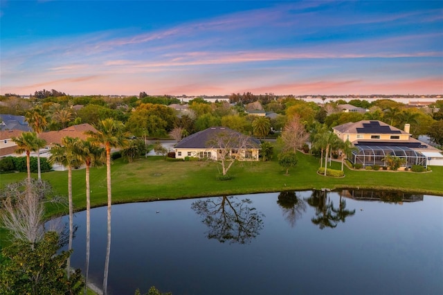 aerial view at dusk with a water view