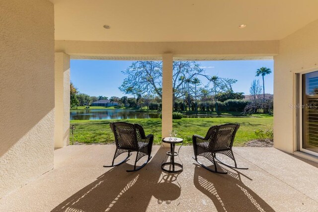 view of patio featuring a water view