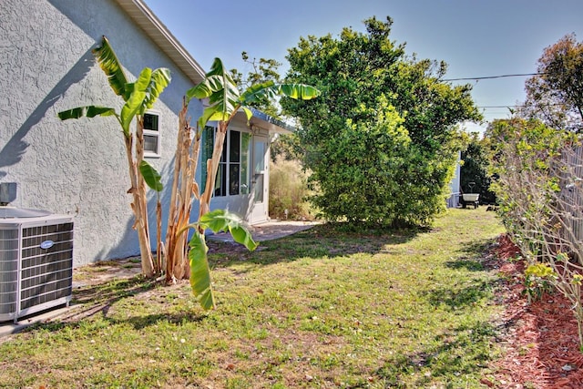 view of yard with central AC