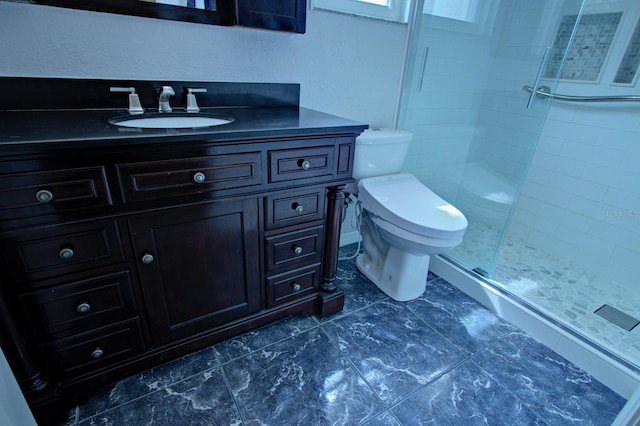bathroom with vanity, toilet, and a shower stall