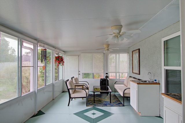 sunroom / solarium with a sink and plenty of natural light