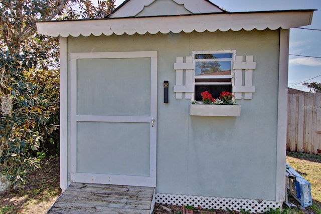view of shed with fence